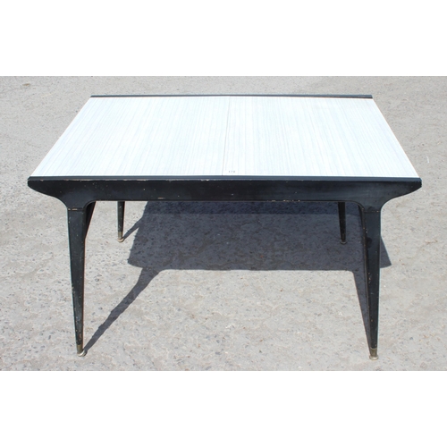 178 - A retro Formica extending dining table by Berry Furniture, approx 122cm wide (152cm extended) x 82cm... 