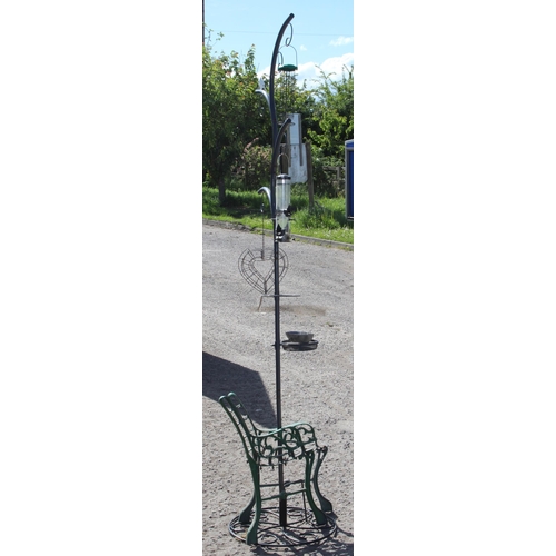 366 - A large garden bird feeder and pair of cast iron bench ends, birdfeeder approx 236cm tall