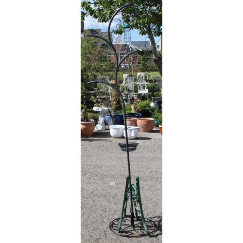 366 - A large garden bird feeder and pair of cast iron bench ends, birdfeeder approx 236cm tall