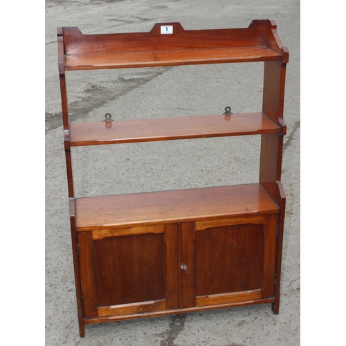 5 - A vintage mahogany bookcase with 2 door cupboard base, approx 69cm wide x 18cm deep x 95cm tall