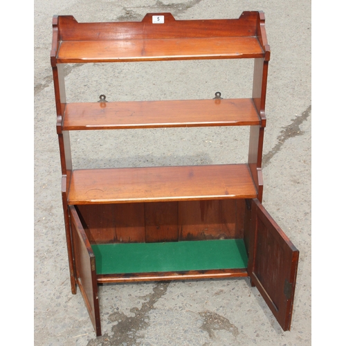 5 - A vintage mahogany bookcase with 2 door cupboard base, approx 69cm wide x 18cm deep x 95cm tall