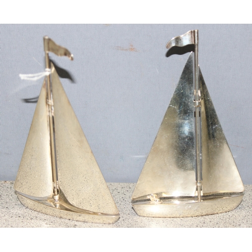 1064 - Pair of silver-plated yachts, approx 13cm H