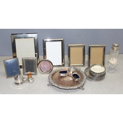 1091 - A large qty of assorted interesting silver plated items to inc a number of photograph frames etc