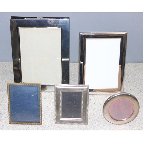 1091 - A large qty of assorted interesting silver plated items to inc a number of photograph frames etc