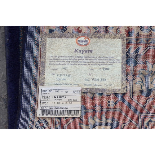 226 - A highly decorative Turkish made Kayam rug of blue ground, approx 230cm wide x 150cm deep