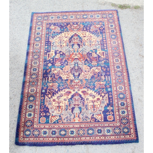 228 - A highly decorative Turkish made Kayam rug of blue ground, approx 185cm wide x 120cm deep