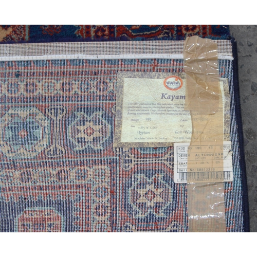 228 - A highly decorative Turkish made Kayam rug of blue ground, approx 185cm wide x 120cm deep