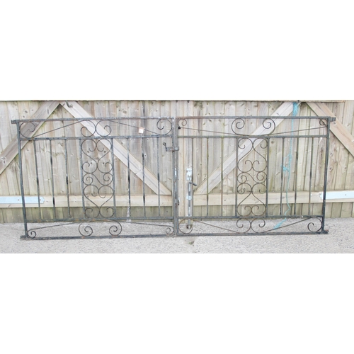 371 - A pair of wrought iron garden drive gates, approx 242cm wide x 93cm tall