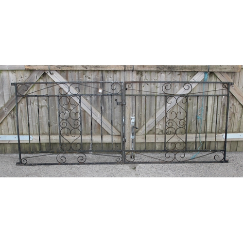 371 - A pair of wrought iron garden drive gates, approx 242cm wide x 93cm tall