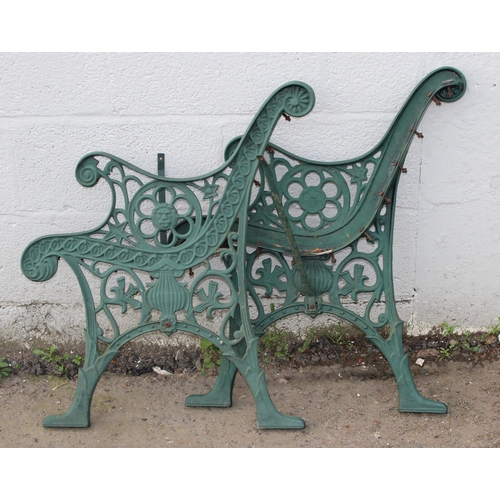 372 - A pair of green painted cast iron bench ends