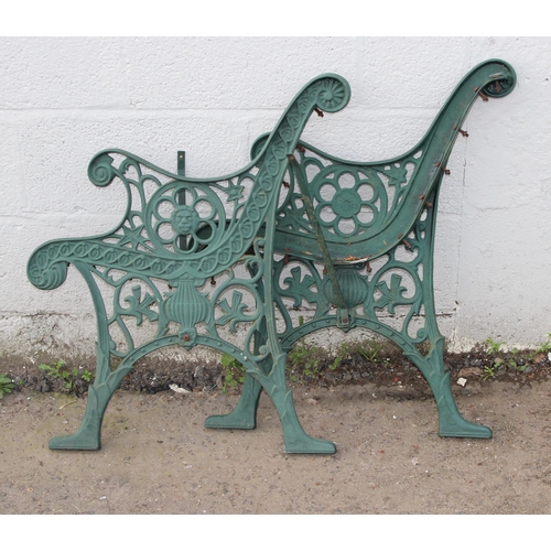 372 - A pair of green painted cast iron bench ends