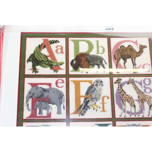 460J - Large animal alphabet rug made from an Elizabeth Bradley tapestry kit in frame, approx 138cm x 87cm