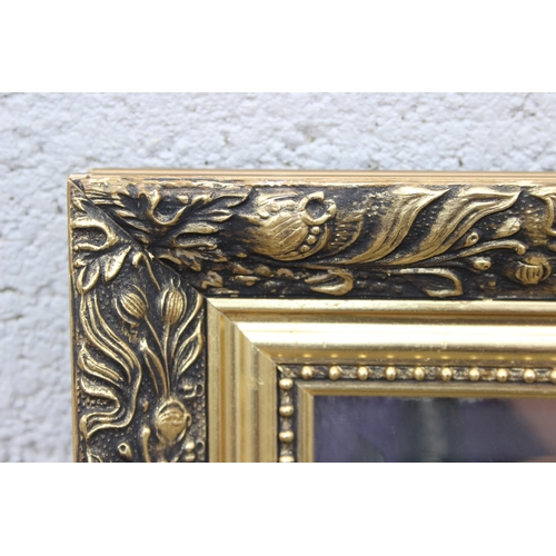 481 - A large decorative gilt framed mirror, approx 135cm x 104cm