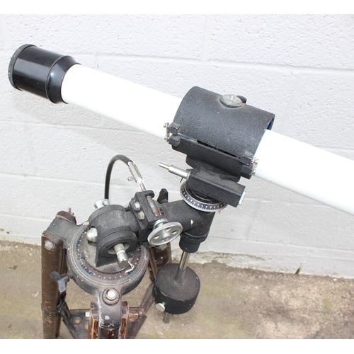 667 - A vintage wooden industrial floor standing tripod with later telescope attachment