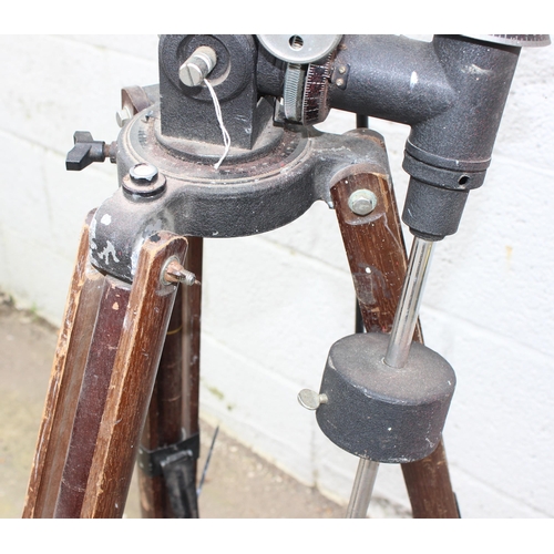 667 - A vintage wooden industrial floor standing tripod with later telescope attachment