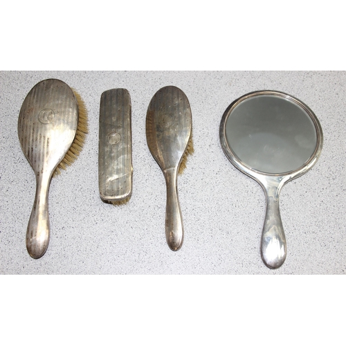 1097 - An early 20th century 4 piece silver backed brush and mirror set with pin striped decoration, variou... 