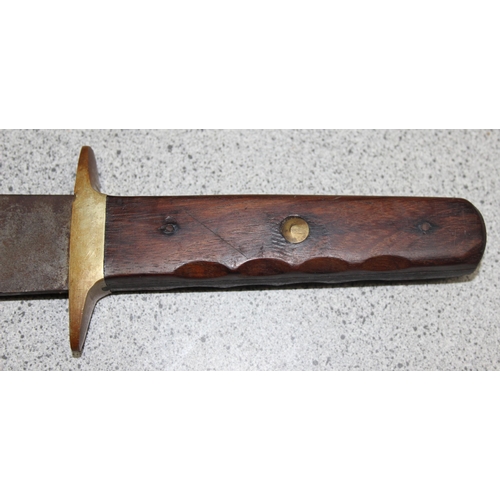 1436 - A large wooden handled Bowie Knife, the blade marked 