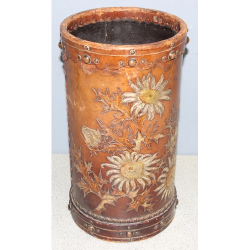 298 - Early 20th century leather stick stand/paper basket decorated with hand painted and embossed flowers... 