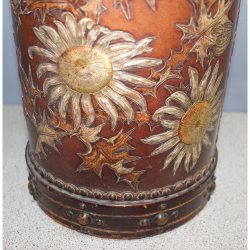 298 - Early 20th century leather stick stand/paper basket decorated with hand painted and embossed flowers... 