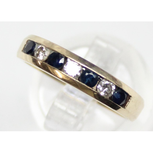 1140E - A retro style 10ct gold ring set with diamonds and sapphires, marked 10k and with 9ct import marks, ... 