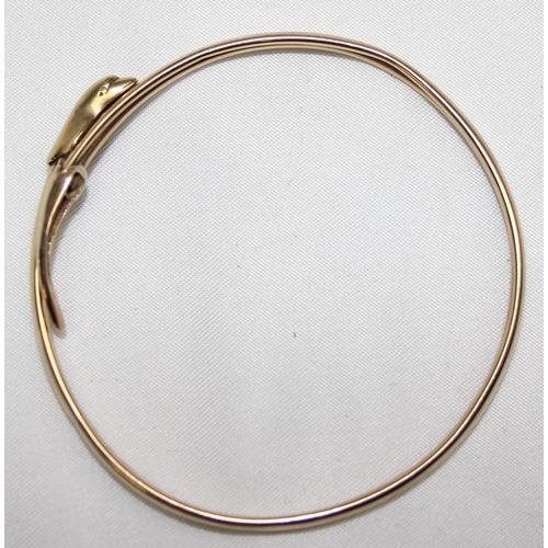 1140P - A 9ct gold torque bangle with dolphin design, marked for Birmingham 1994, approx 5.84g gross, with m... 