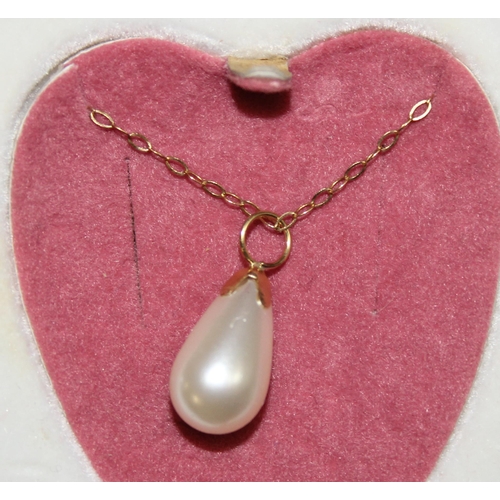 1140R - A 9ct gold mounted faux pearl necklace and earring set in box, indistinctly marked but XRF confirmed