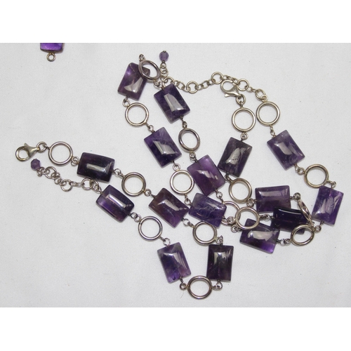 1160I - A silver mounted and cabochon purple stone necklace bracelet and earrings etc, the necklace approx 4... 