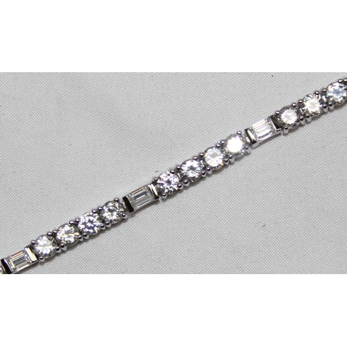 1160J - A 925 silver and white stone tennis bracelet, marked and XRF confirmed, approx 19cm long, presented ... 