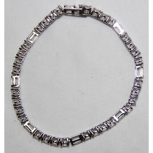 1160J - A 925 silver and white stone tennis bracelet, marked and XRF confirmed, approx 19cm long, presented ... 