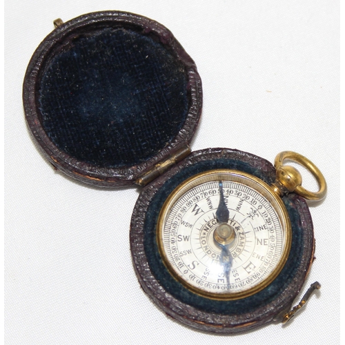 666 - A miniature antique gilt metal cased pocket compass by Negretti & Zambra, housed in original leather... 