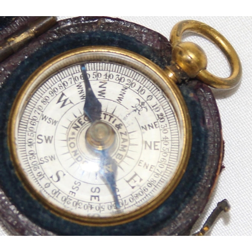 666 - A miniature antique gilt metal cased pocket compass by Negretti & Zambra, housed in original leather... 