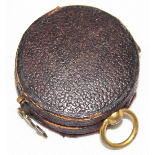 666 - A miniature antique gilt metal cased pocket compass by Negretti & Zambra, housed in original leather... 