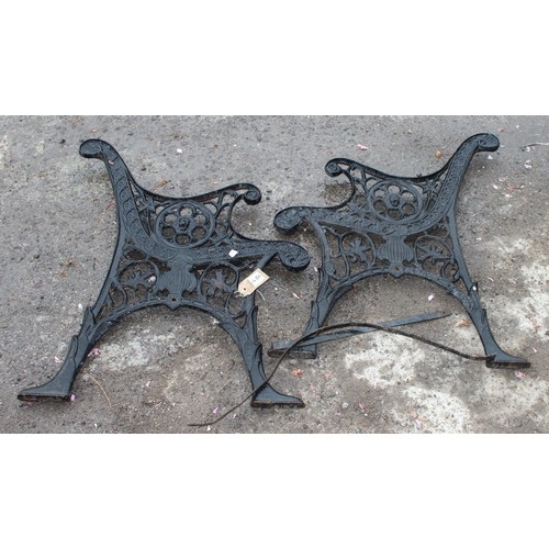 308 - A pair of black painted antique style cast iron bench ends, approx 57cm wide x 71cm tall