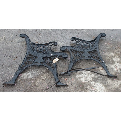 308 - A pair of black painted antique style cast iron bench ends, approx 57cm wide x 71cm tall