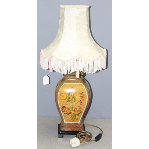 253 - Ceramic hand painted lamp decorated with floral design on footed base with shade, approx 74cm incl s... 