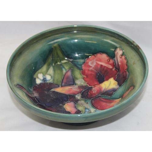 1604G - Moorcroft pottery footed bowl in the Orchid pattern (af), approx 17cm diam