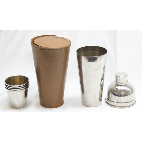 1016 - A vintage silver plated travelling cocktail shaker with 4 small beakers, all housed in a leather cas... 