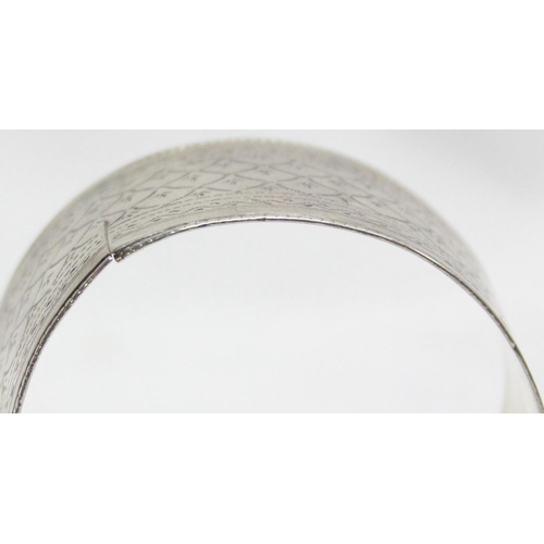 1033 - A very large French silver napkin ring, marked and XRF confirmed as approx 82% silver, approx 55mm i... 