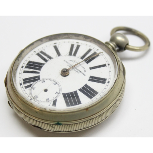 1054 - An antique silver pocket watch stand containing pocket watch, marked for London 1904 by Goldsmiths &... 