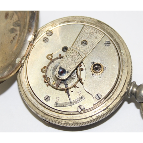 1054 - An antique silver pocket watch stand containing pocket watch, marked for London 1904 by Goldsmiths &... 