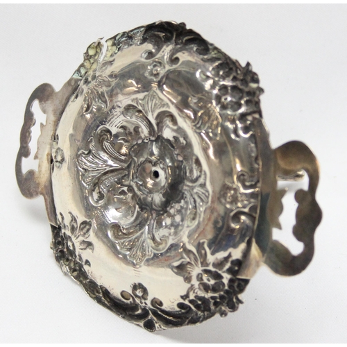 1078 - An Edwardian silver dressing table ring tree with embossed tray, Birmingham 1903 by Robert Pringle, ... 