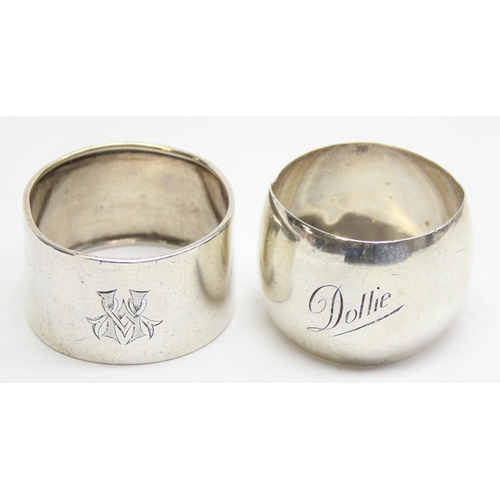 1079 - 2 silver napkin rings, one with initials the other marked Dollie, approx 55.73g gross