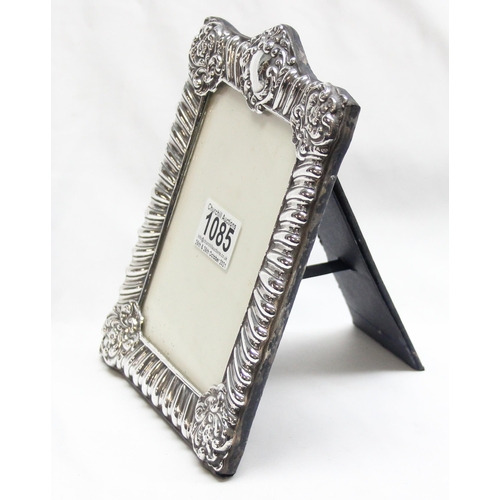 1085 - An antique style silver photograph frame with easel back, marked for London 1990, approx 20cm x 15cm