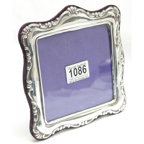 1086 - An antique style silver photograph frame with easel back, marked for Birmingham 1997, approx 17cm x ... 