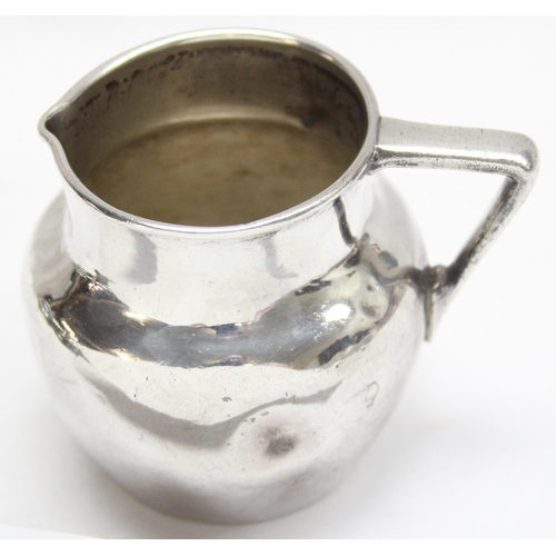 1095 - A small antique silver cream or milk jug, London 1918, approx 7cm tall, approx 96.84g gross