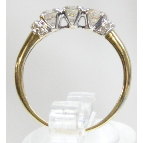 1110B - A vintage 18ct gold trilogy diamond ring, set with 3 larger diamonds and smaller diamond shoulder mo... 