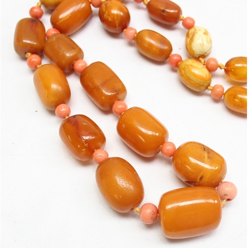 1198 - A vintage Amber bead necklace, a mixture of oval and cylindrical beads with alternate circular coral... 