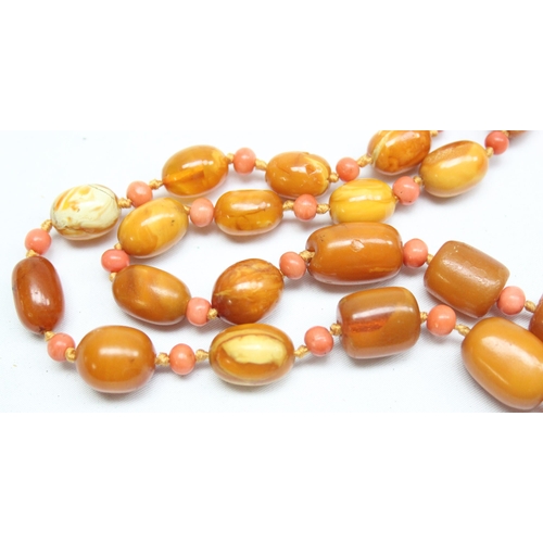 1198 - A vintage Amber bead necklace, a mixture of oval and cylindrical beads with alternate circular coral... 