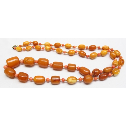 1198 - A vintage Amber bead necklace, a mixture of oval and cylindrical beads with alternate circular coral... 