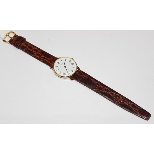 1334 - A vintage Garrard gold plated watch with mechanical movement, crocodile effect leather strap and ori... 